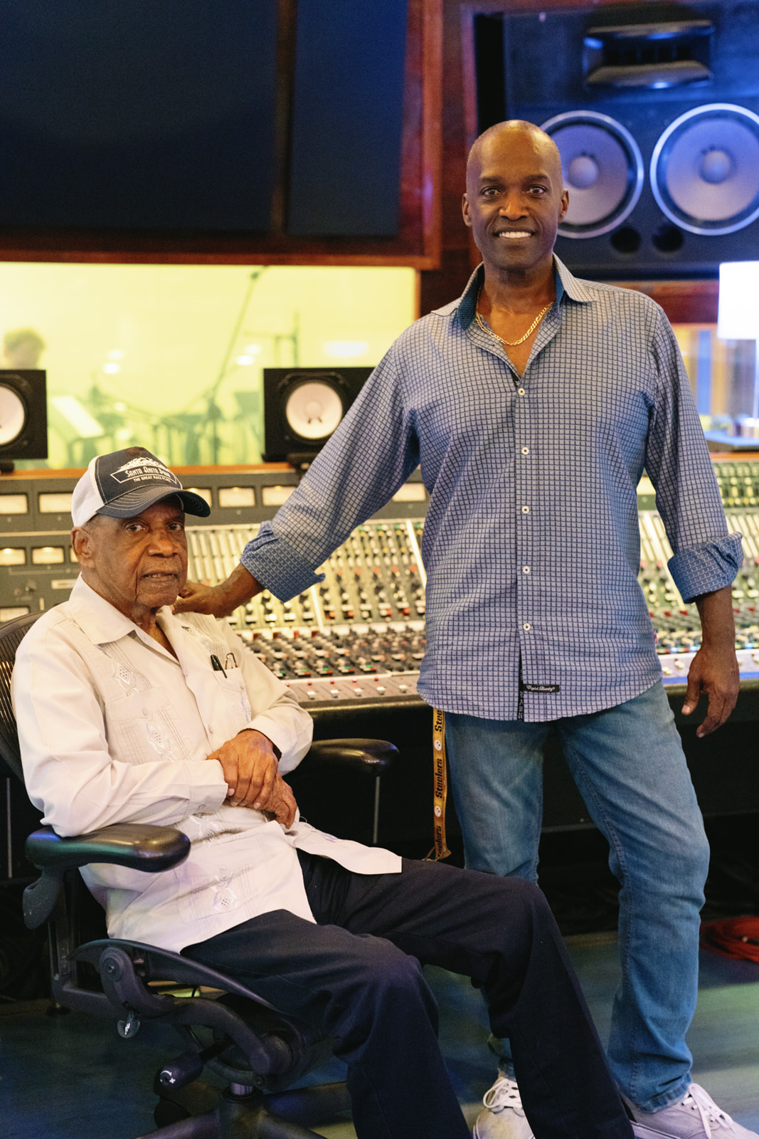 Carlos Malcolm with son Leighton, in the studio
